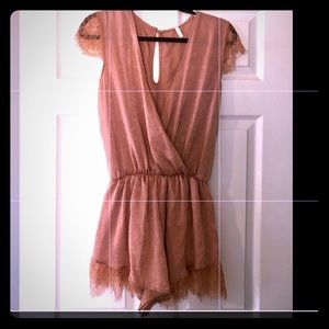 melon color romper with lace by Sage